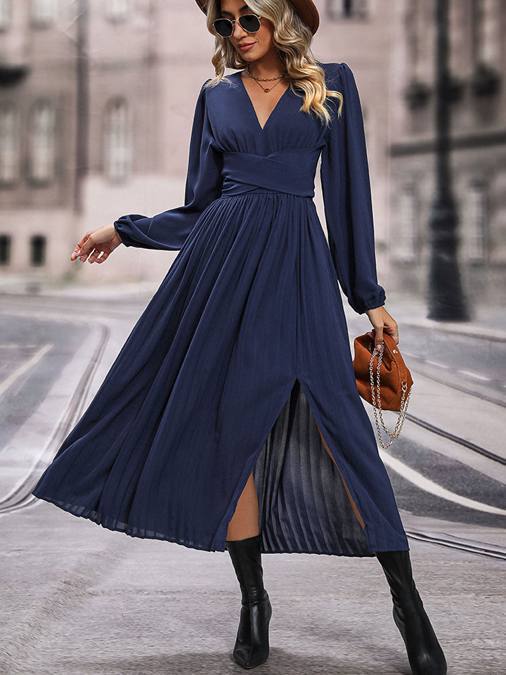 Dark blue V-neck long sleeve pleated dress with ruched waist and side slit