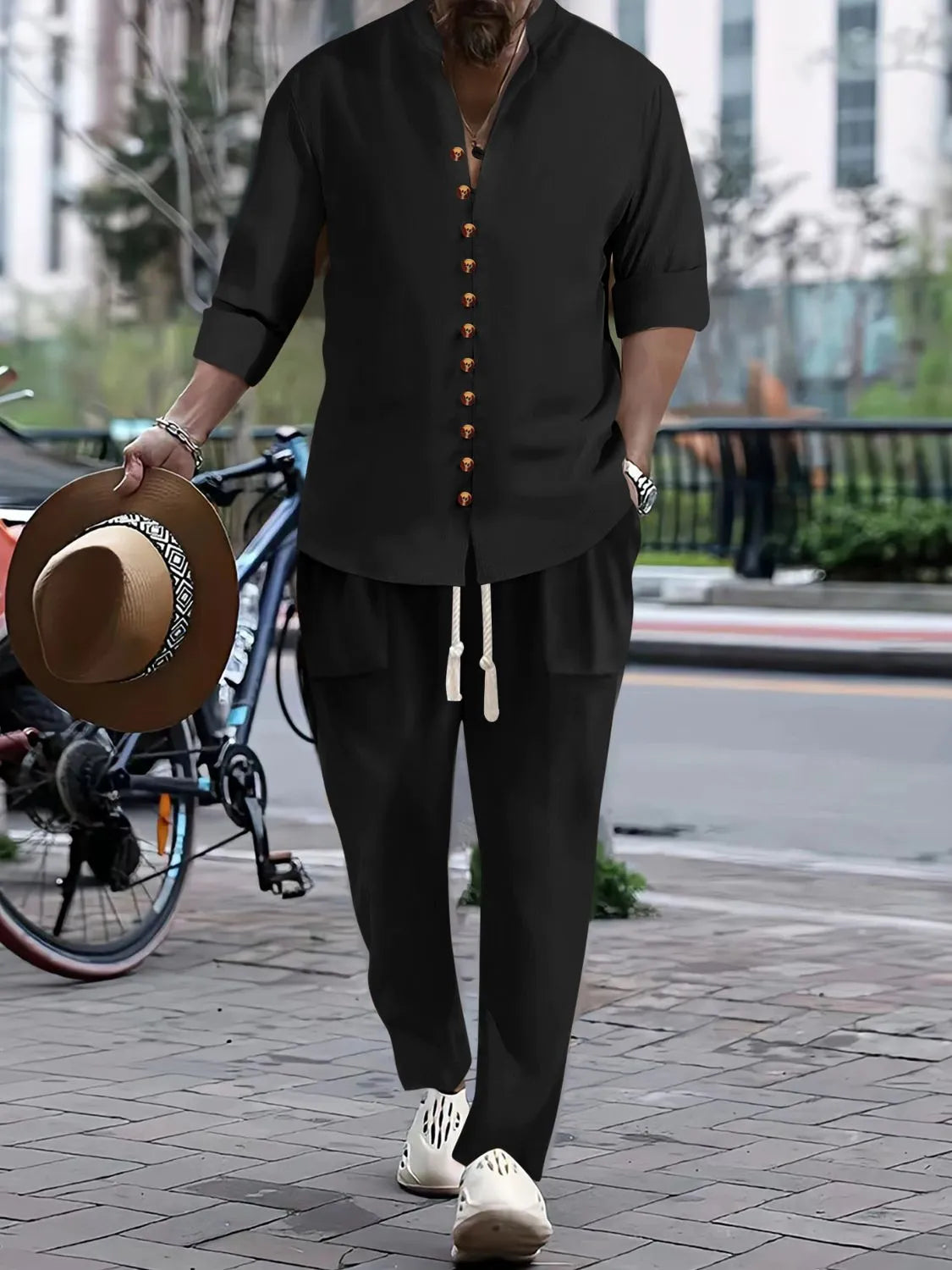 Men's black button-front long-sleeve shirt and pants set with gold buttons