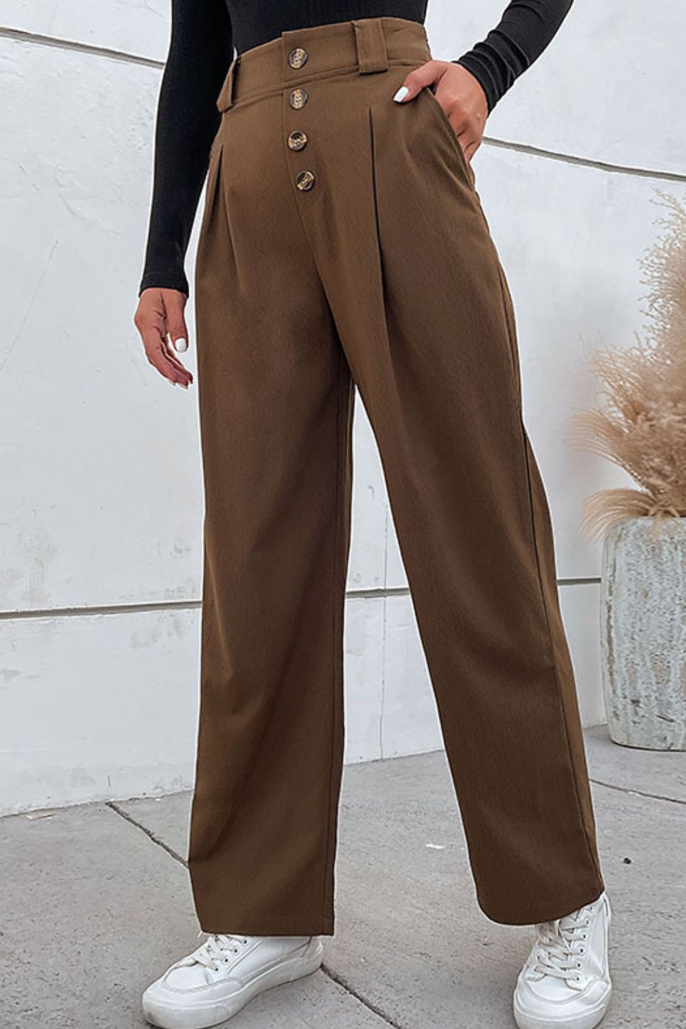 Brown high-waist wide-leg pleated pants with button fly and side pockets