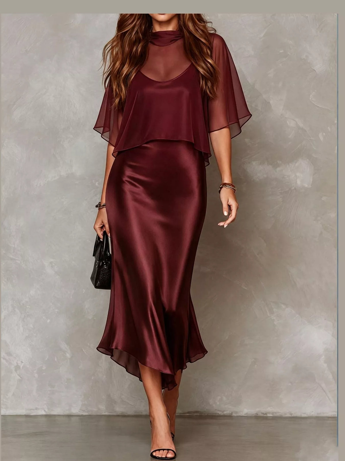 Burgundy satin slip midi dress with sheer cape sleeves and draped layered top