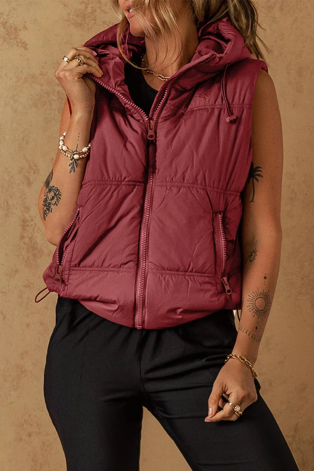 Burgundy hooded sleeveless puffer vest coat with front zipper and ribbed drawstring hem