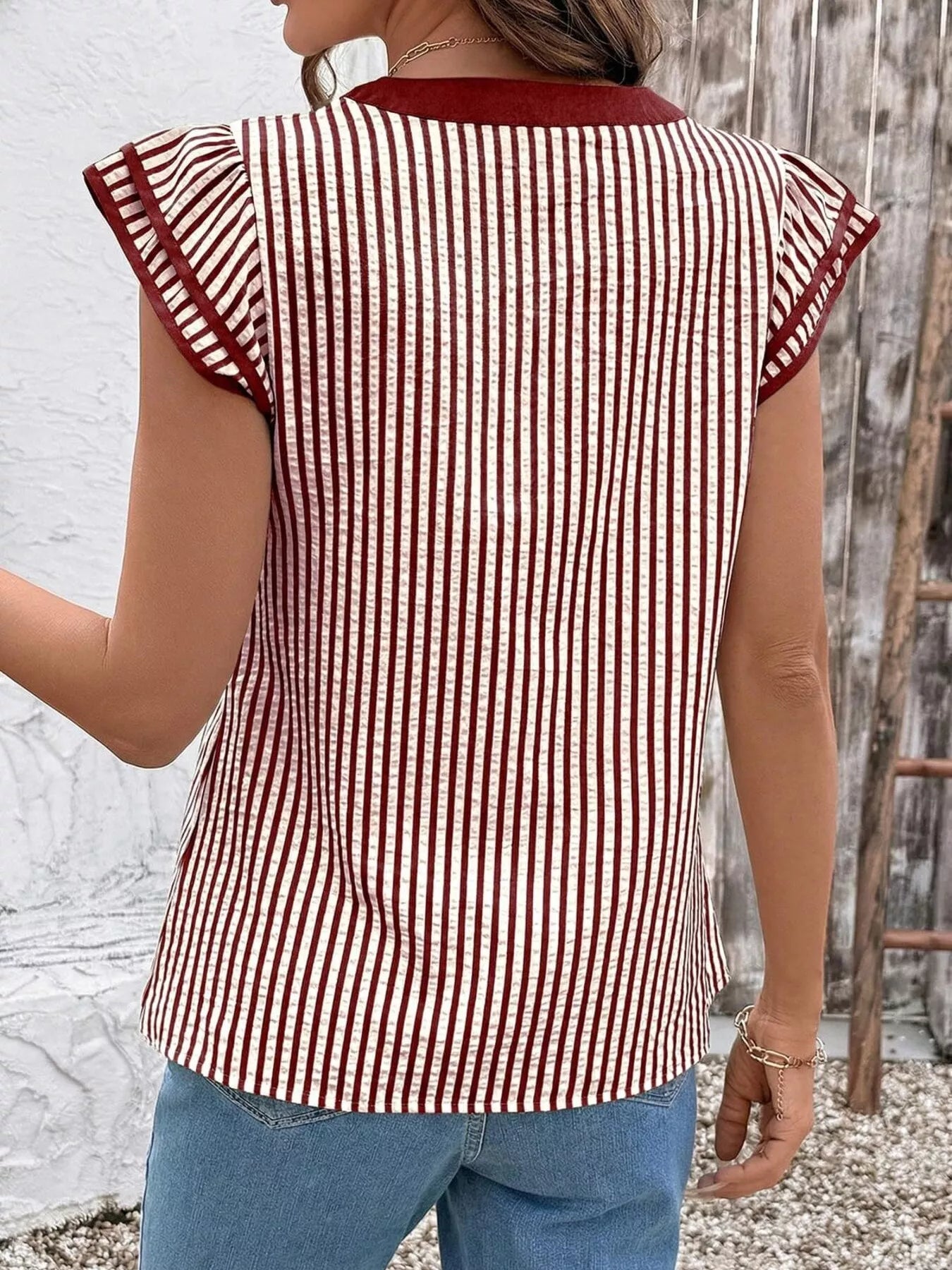 Striped Ruffle Sleeve Blouse by Trendsi; burgundy-and-white vertical stripes, maroon trim on ruffled sleeves, back view.