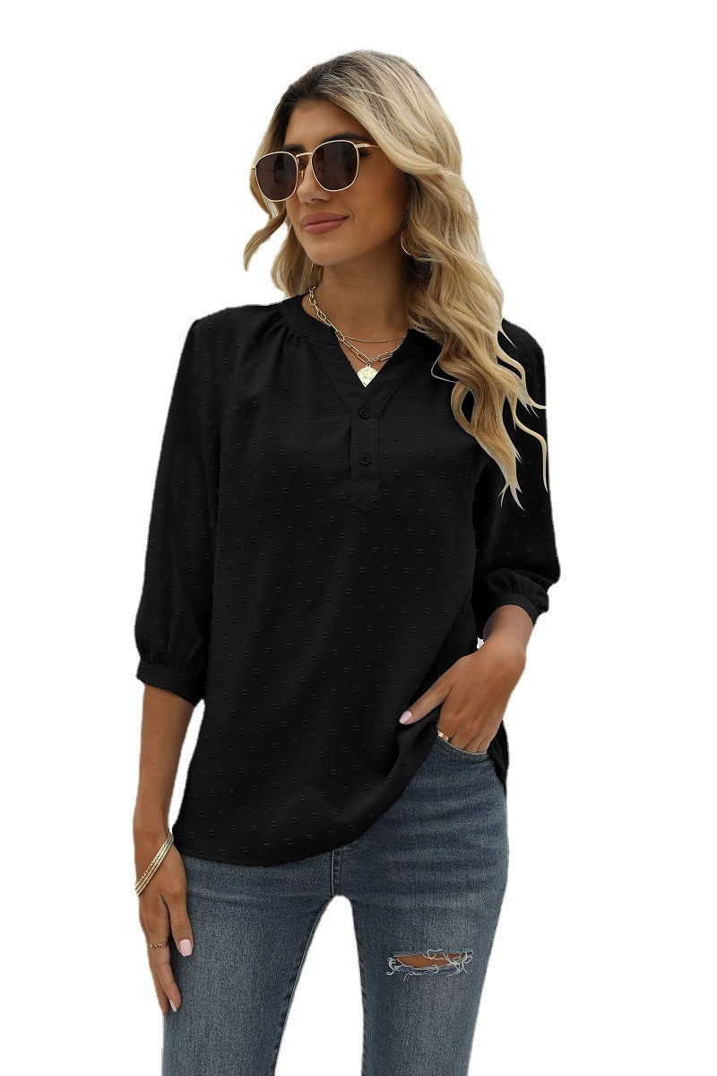 Black Swiss-dot blouse with notched V-neck and 3/4 sleeves, button front