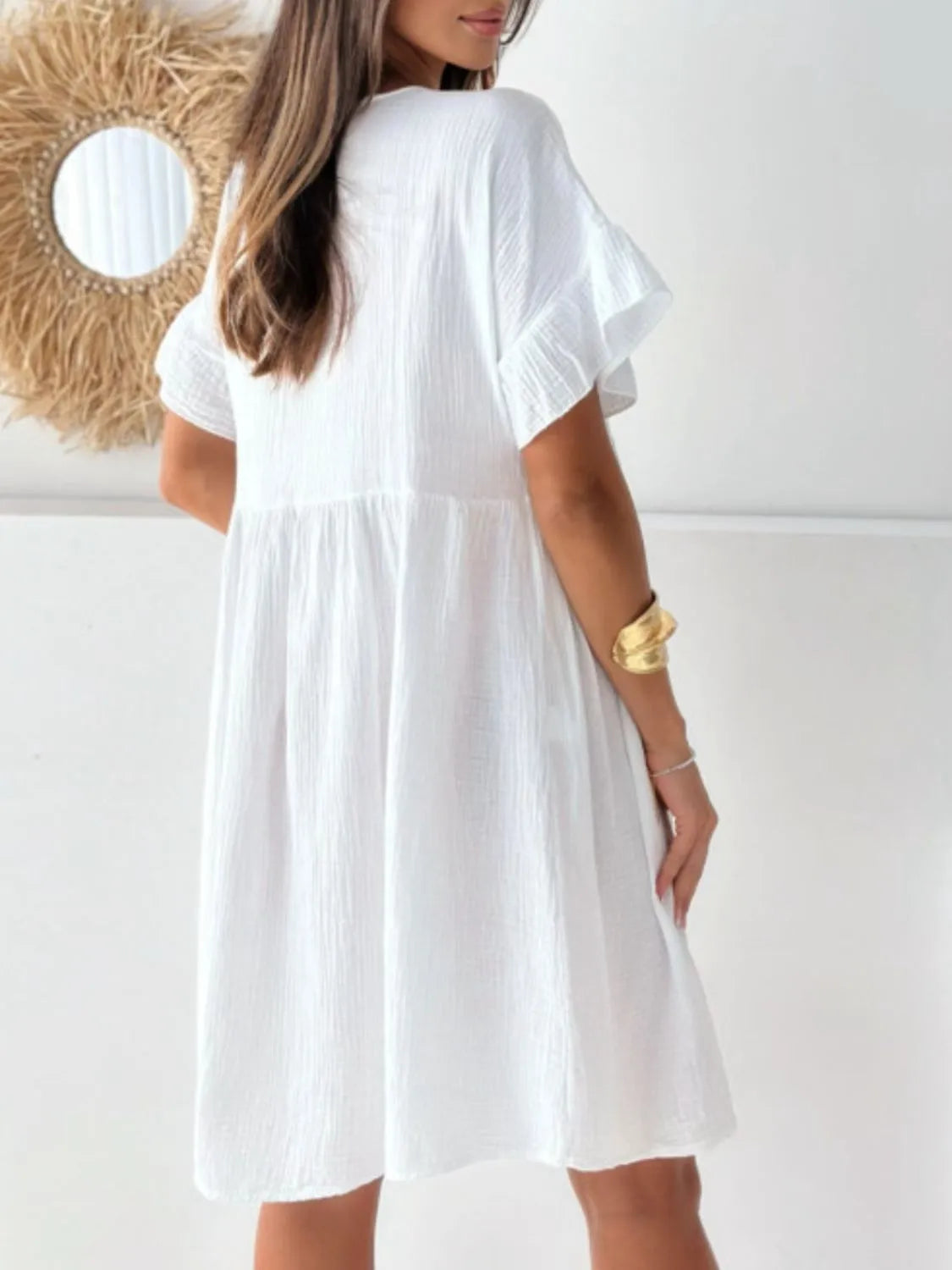 Round Neck Short Sleeve Mini Dress in white, loose silhouette; back view on model showcasing relaxed fit