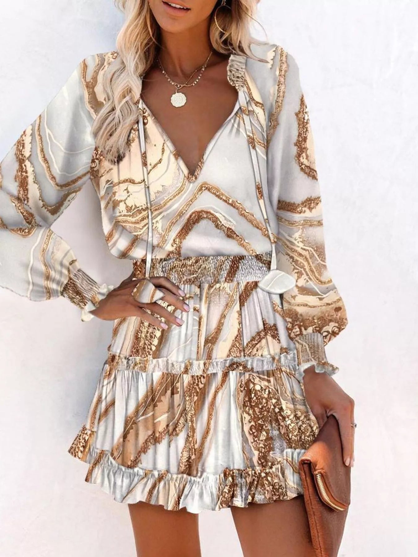 Tie-neck lantern sleeve dress in white with tan gold swirling patterned print