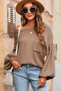 Camel round-neck dropped-shoulder sweater with long sleeves and front pocket