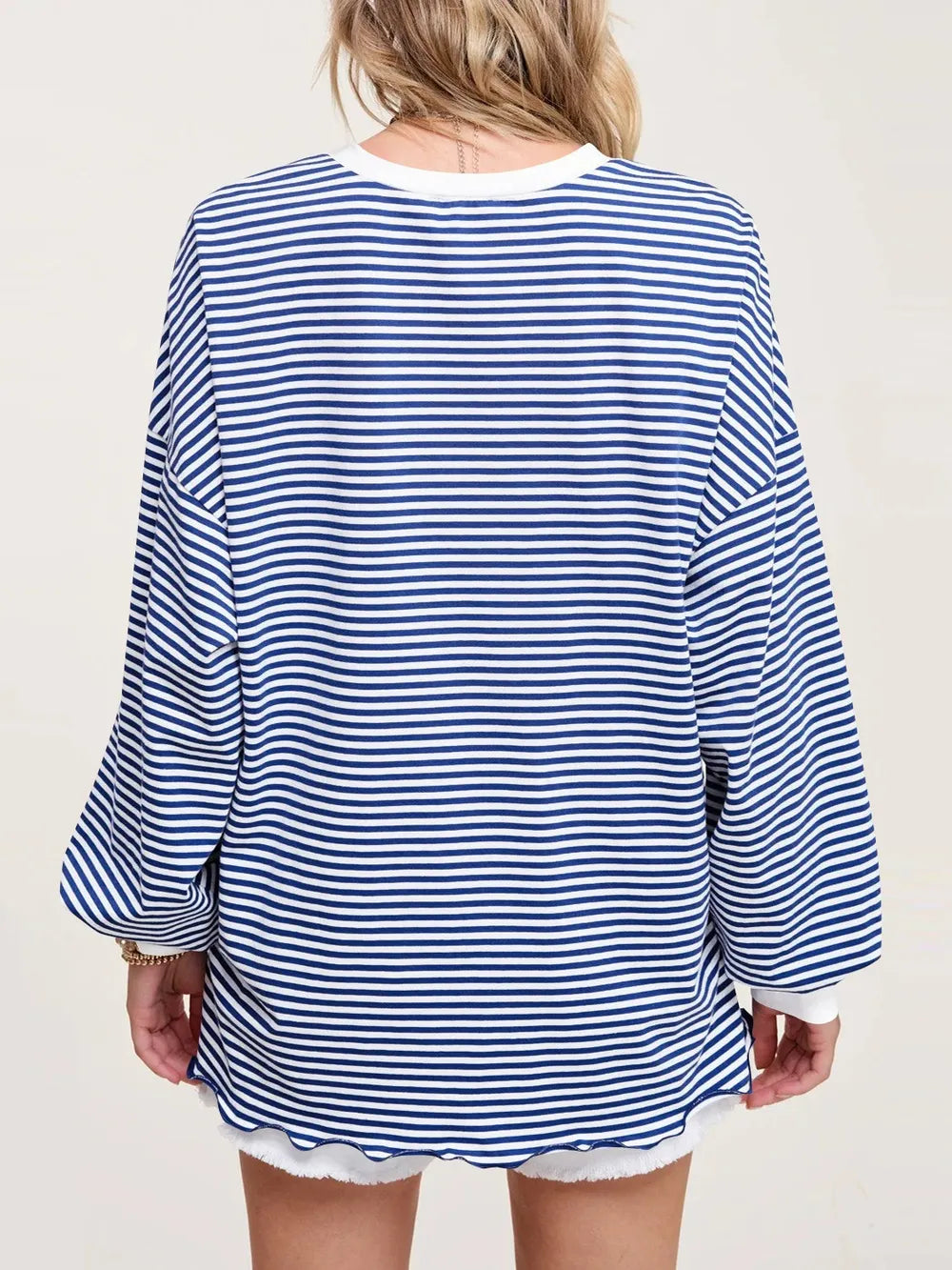 Contrast striped long sleeve sweatshirt in blue and white, back view with wide sleeves