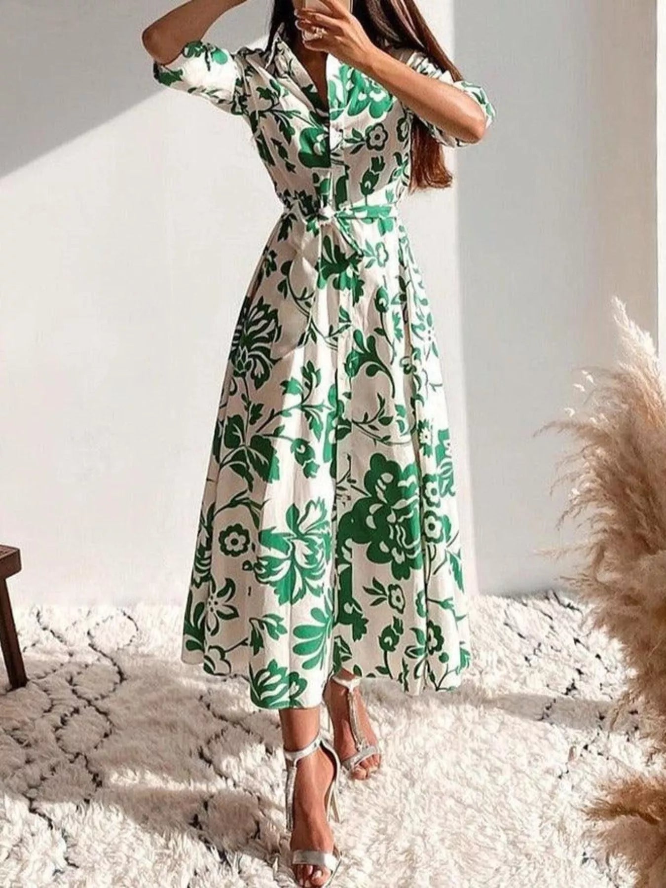 Green floral belted midi dress with V-neck and flared skirt, three-quarter view