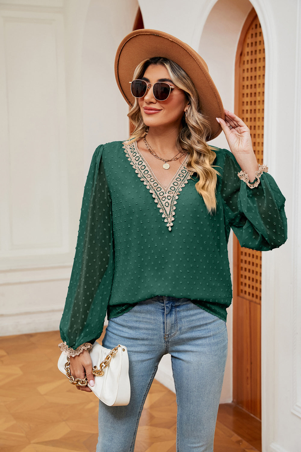 Green swiss-dot V-neck blouse with cream trim at neckline and scalloped cuffs