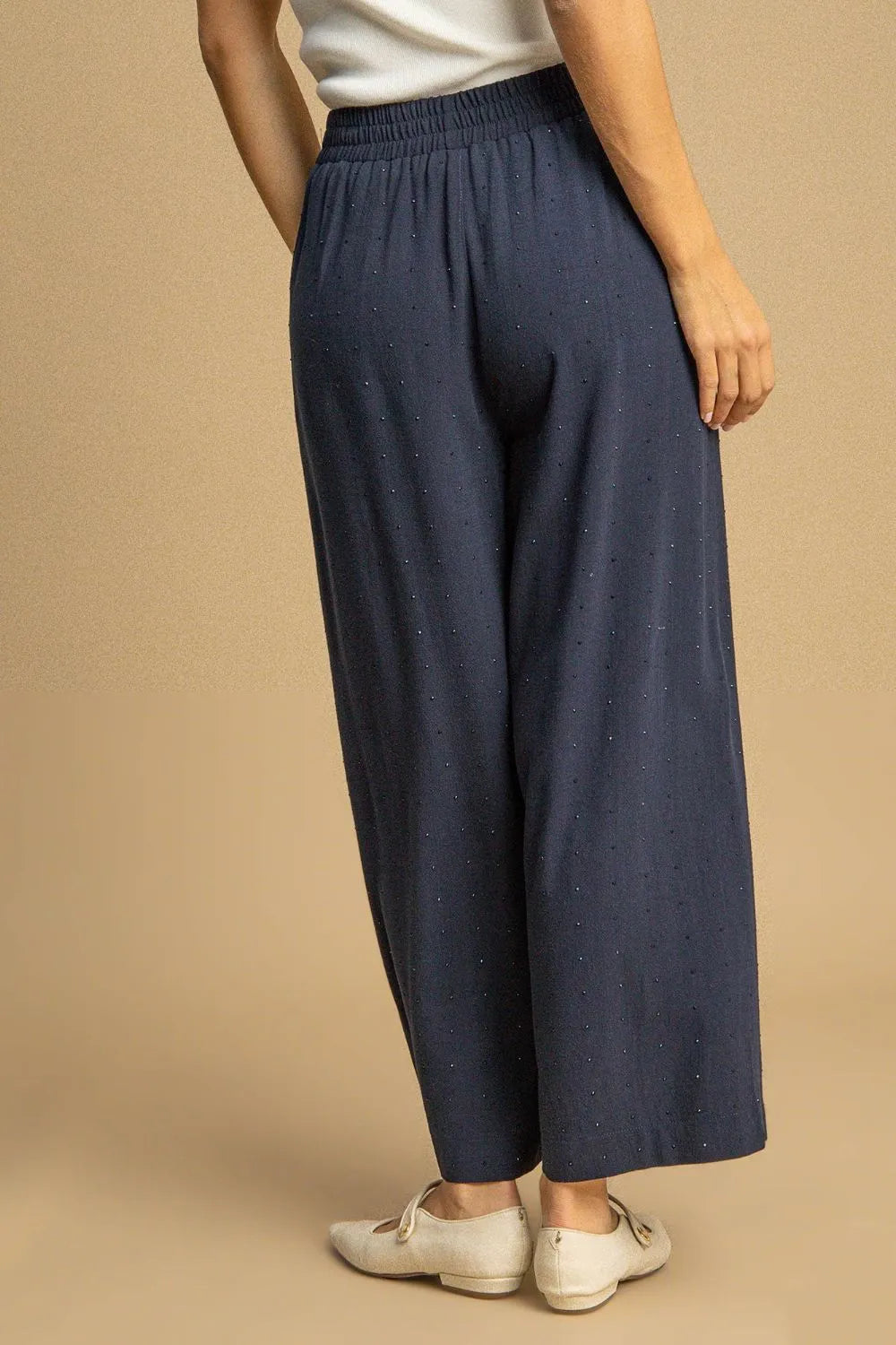High-waisted dark blue linen pants with elastic waistband and straight wide fit