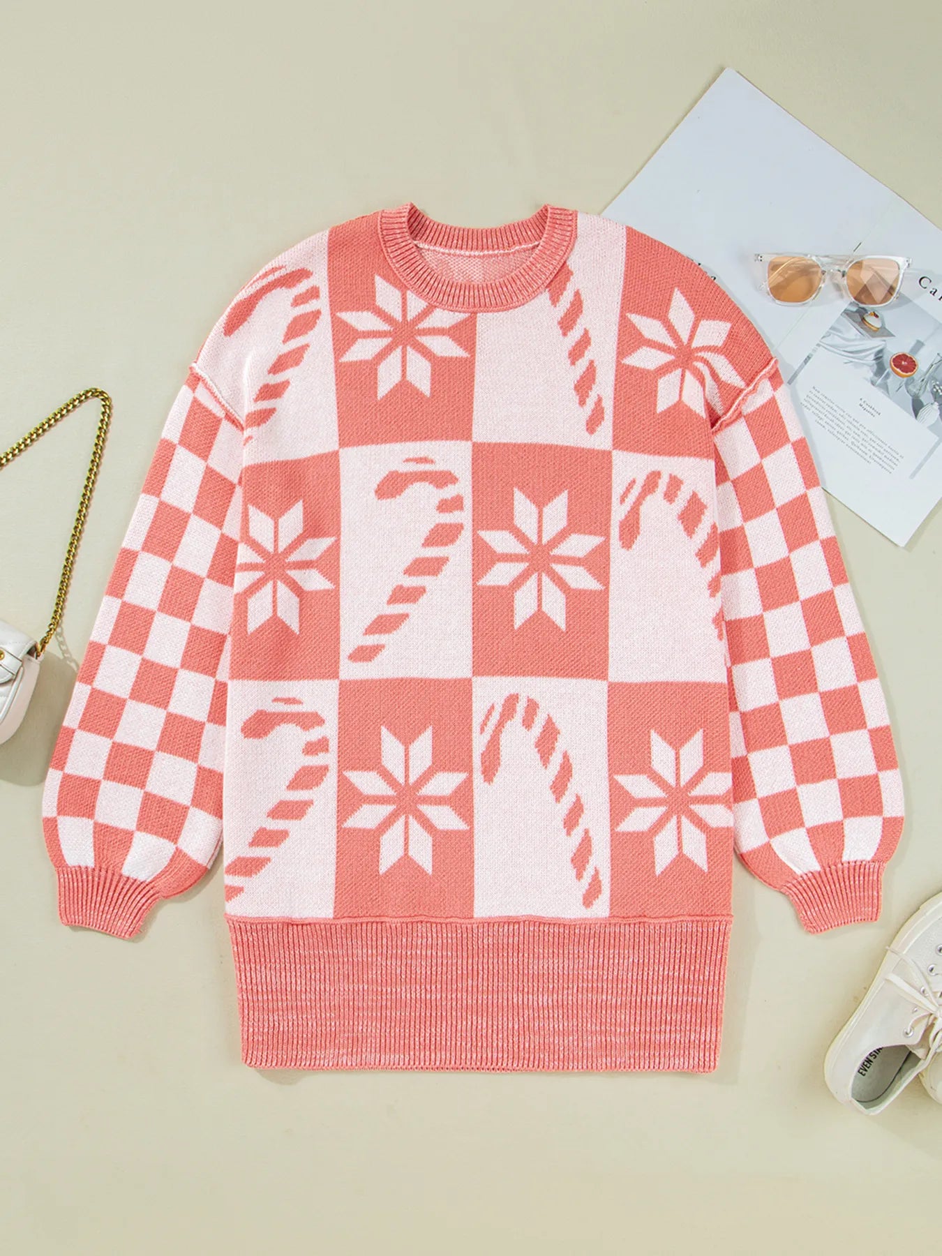 Burnt coral and white knit sweater with crew neck, drop shoulder, and checker snowflake pattern