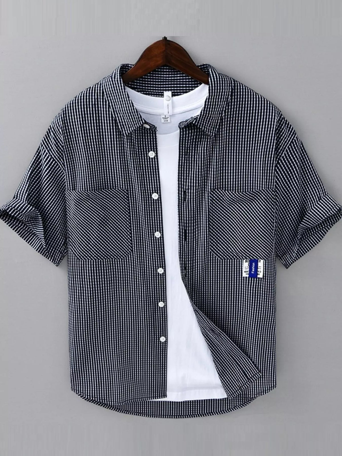 Navy and white plaid short-sleeve cotton button-up shirt with chest pockets and front buttons