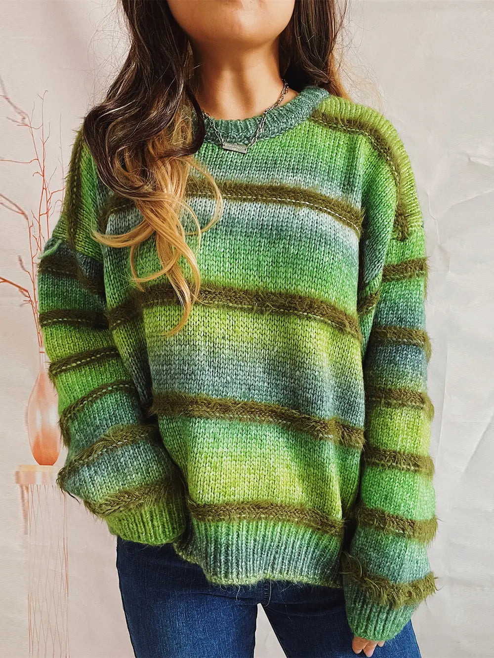 Striped round-neck long-sleeve sweater in green with lighter horizontal bands
