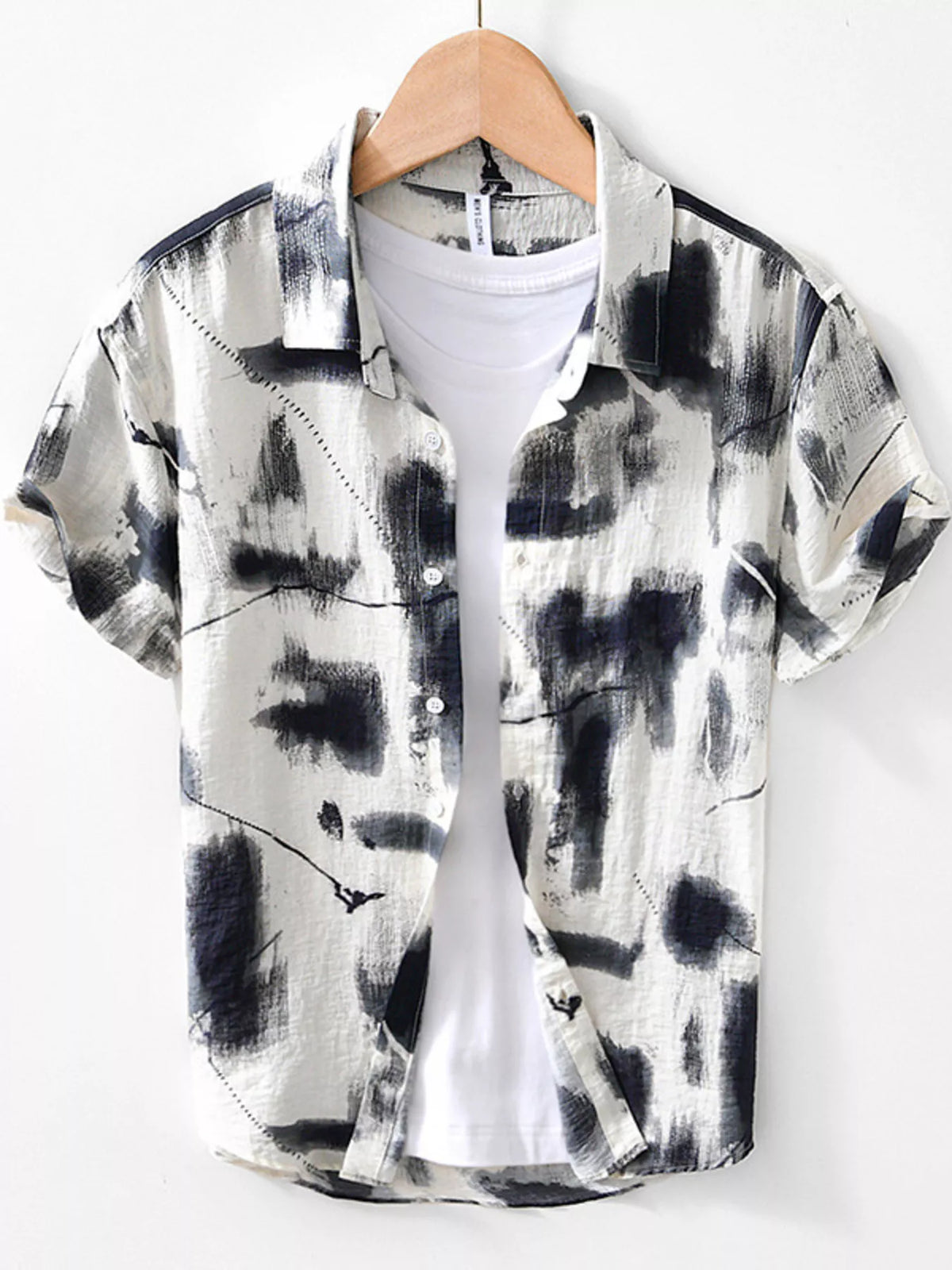 Men's short-sleeve button-up shirt with light-and-dark abstract print front