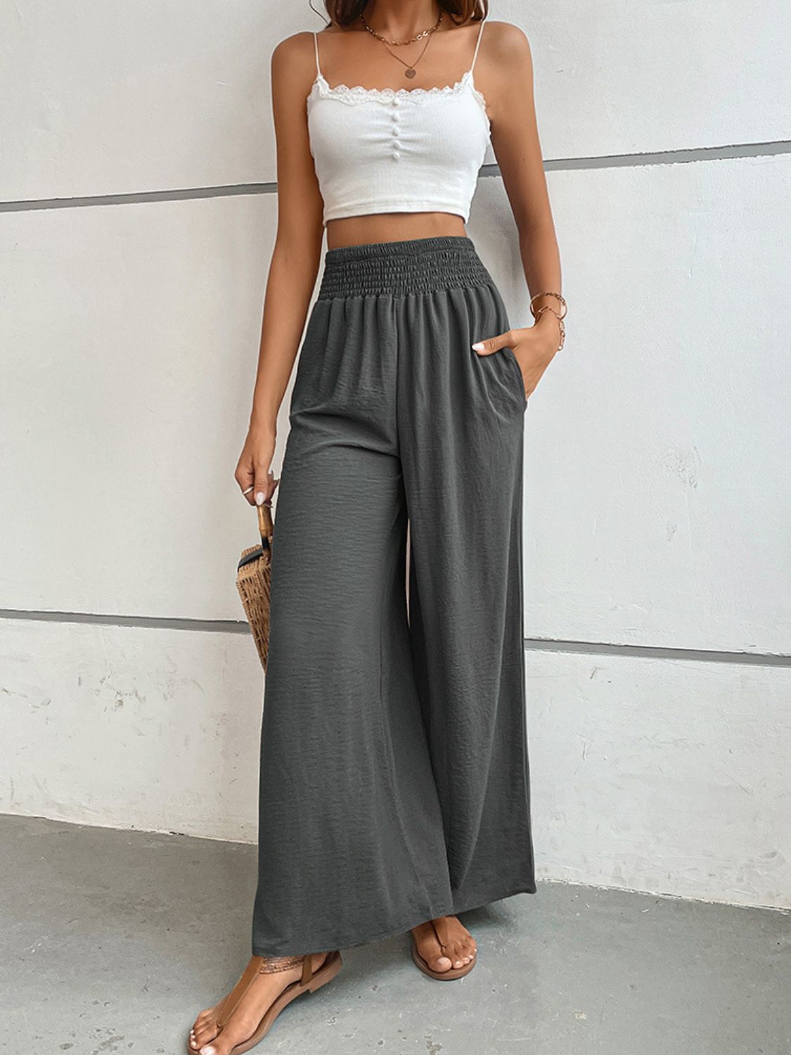 Dark gray relaxed wide-leg long pants with elastic waist and flowing silhouette