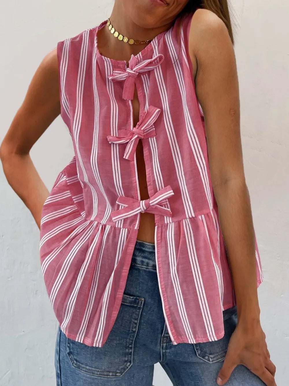 Striped round-neck tank top, pink with white vertical stripes, bow ties down front