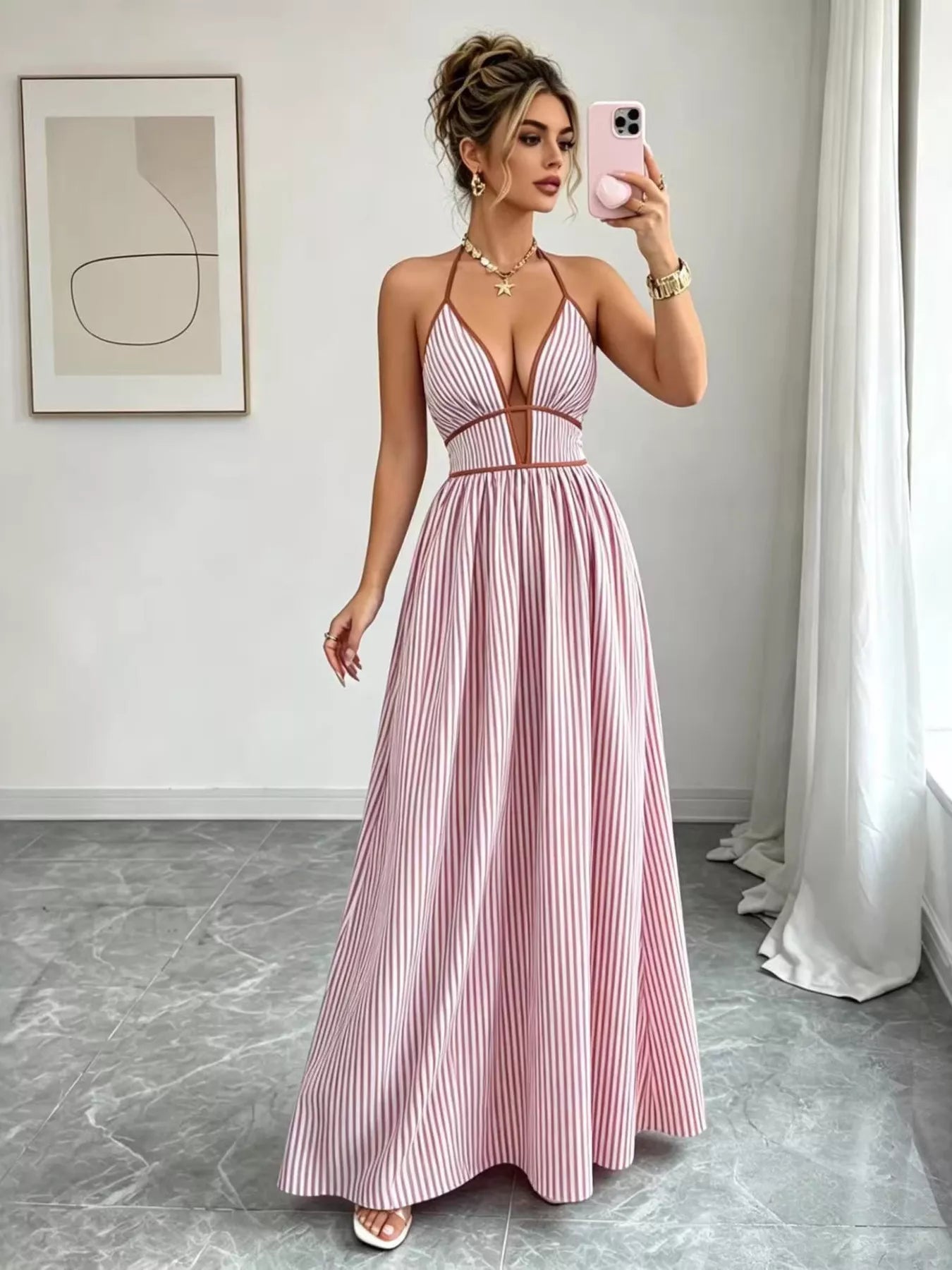 Pink striped halter neck maxi dress with deep V neckline and gathered waist