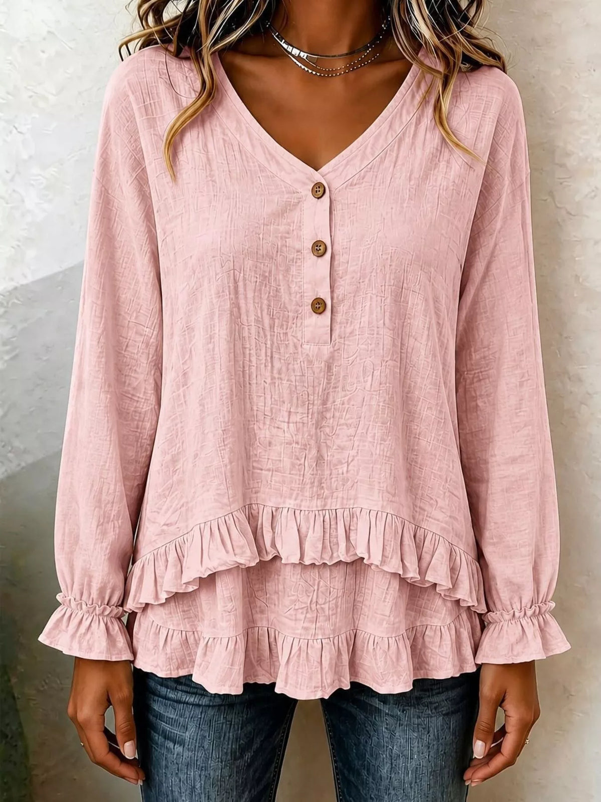 Pink V-neck long-sleeve blouse with front buttons and ruffled tiered hem