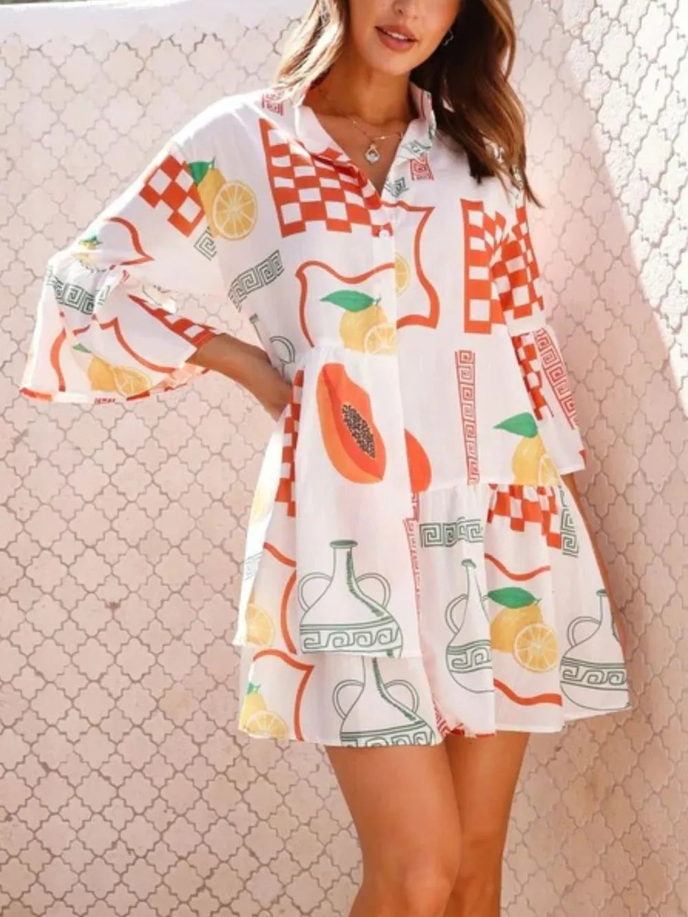 White printed mini dress with three-quarter sleeves, orange check and lemon, flag and vase motifs