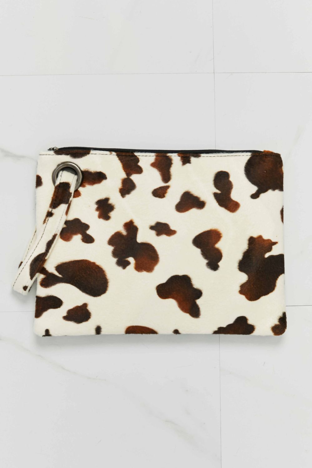Leopard-print wristlet pouch, white fabric with brown spots and zip closure