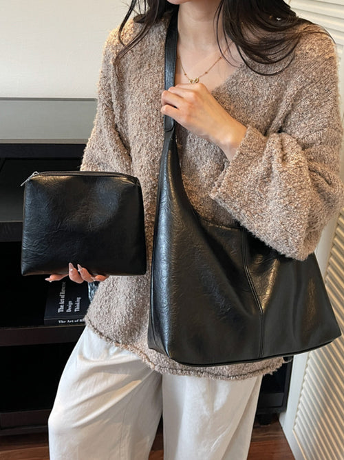 Adjustable Strap Shoulder Bag two-item set in black PU with clutch.