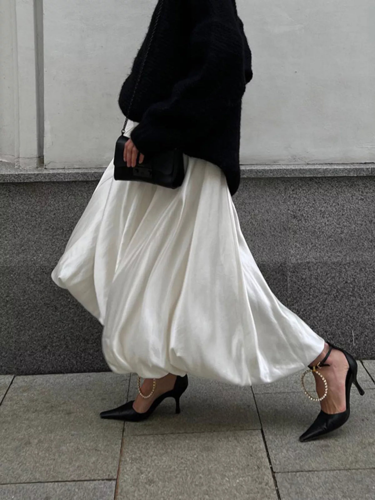 White satin maxi skirt with back zipper, gathered waist, and full drape