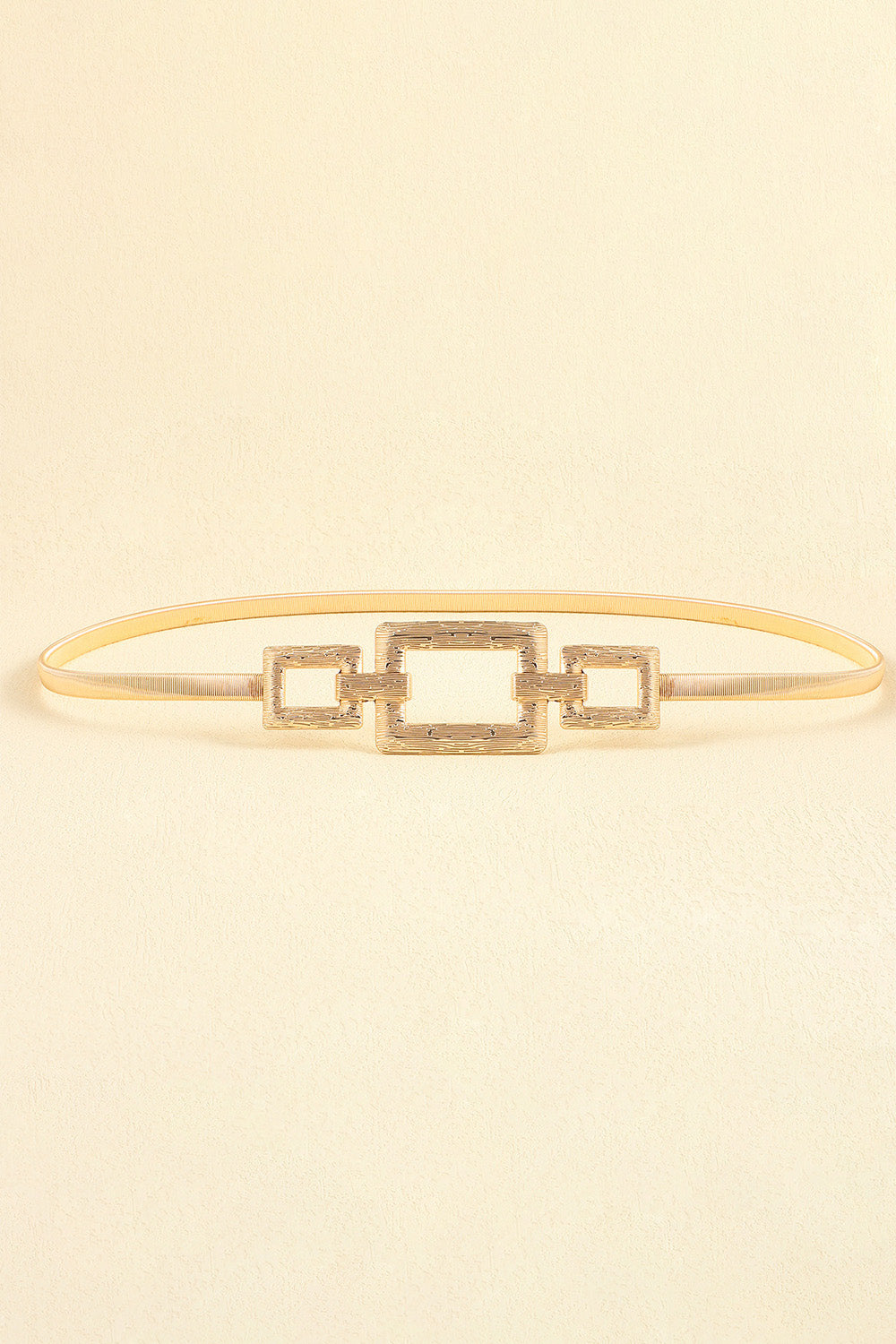 Gold belt with rectangular center square buckle and matching square side accents