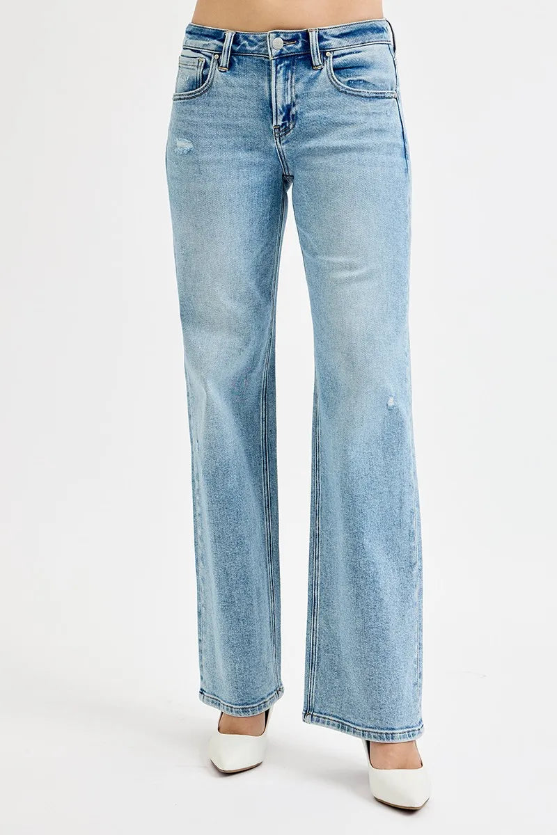 Medium-wash low-rise boyfriend jeans with ankle length and subtle whiskering