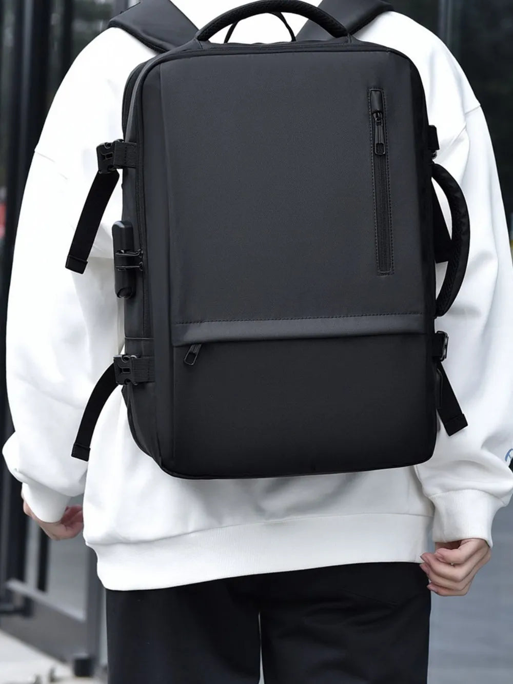 Black backpack with front organizer-style panel and adjustable shoulder straps
