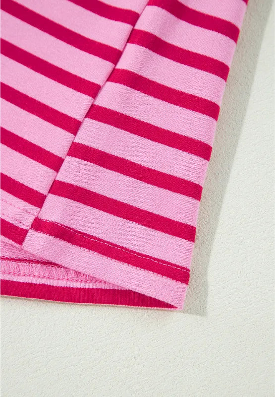 Hot pink and white striped sleeve with stitched hem and cuff detail.