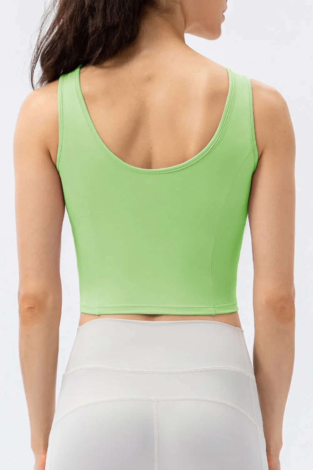 Green active tank top with wide back straps and round neckline
