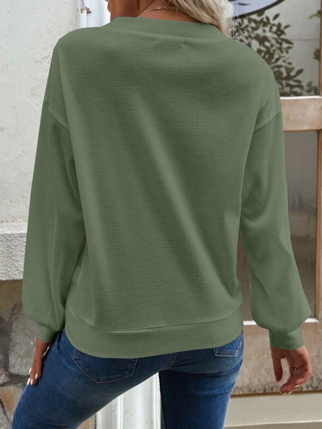 Matcha green blouse with V-neck, dropped shoulders, long sleeves, back view