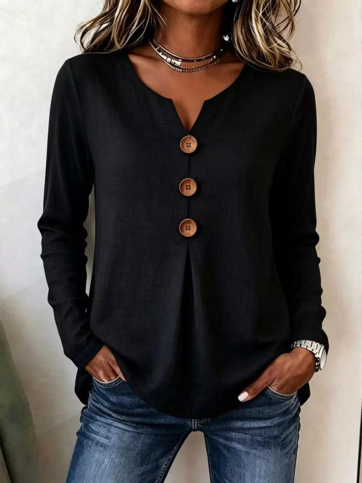 Black long sleeve blouse with V-neck and decorative button front