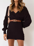 Black ribbed V-neck sweater dress with lantern sleeves, belted waist