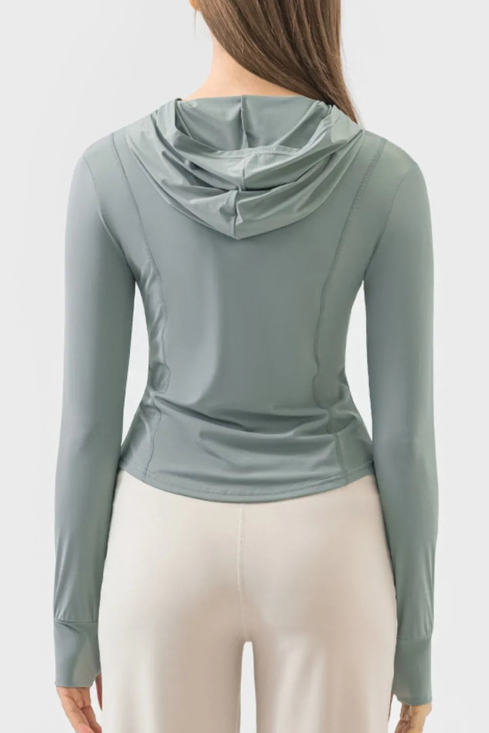 Back view teal zip-up hooded active jacket with long sleeves