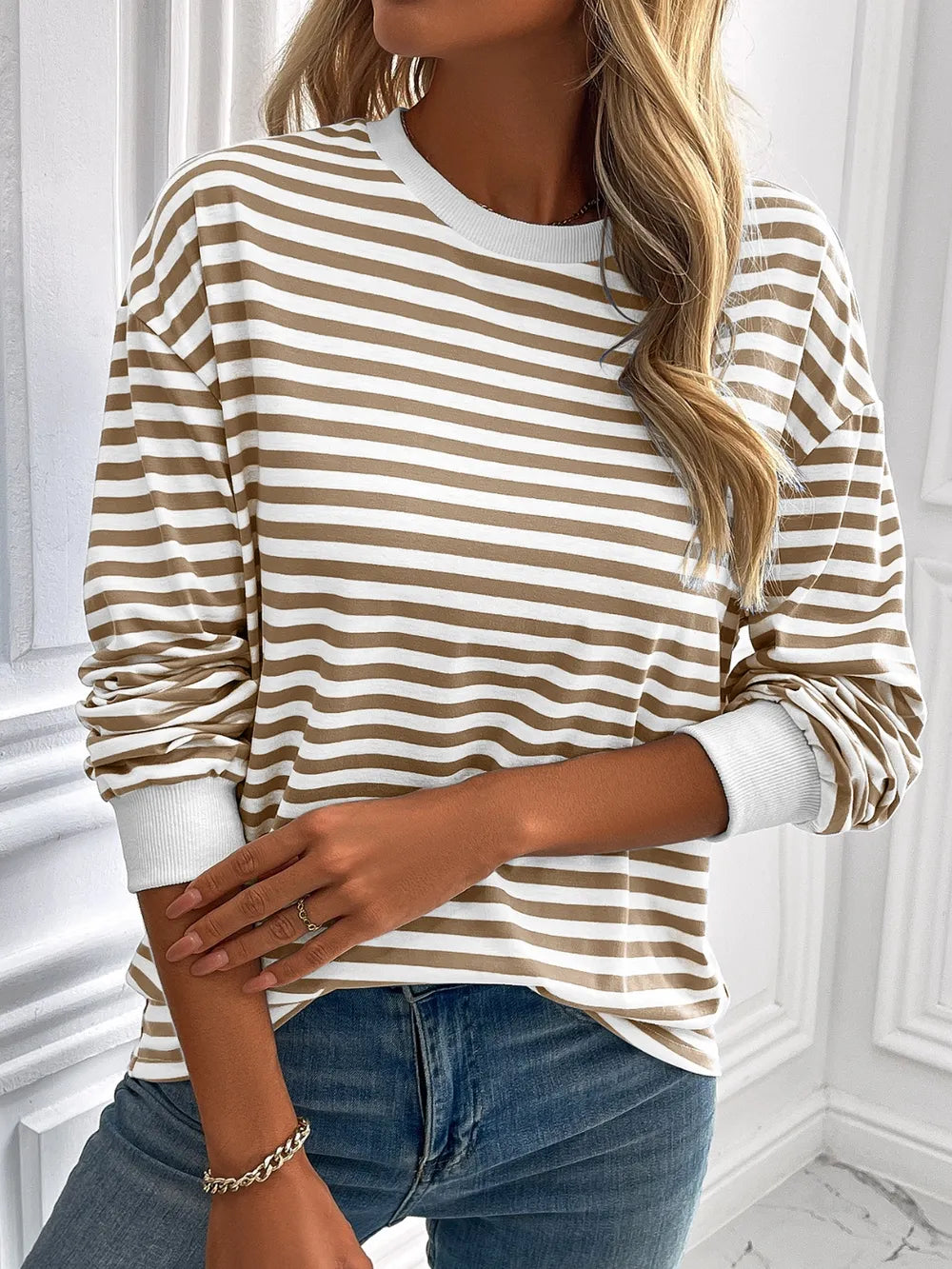 Striped long-sleeve sweatshirt with round neck, tan and white stripes, relaxed fit
