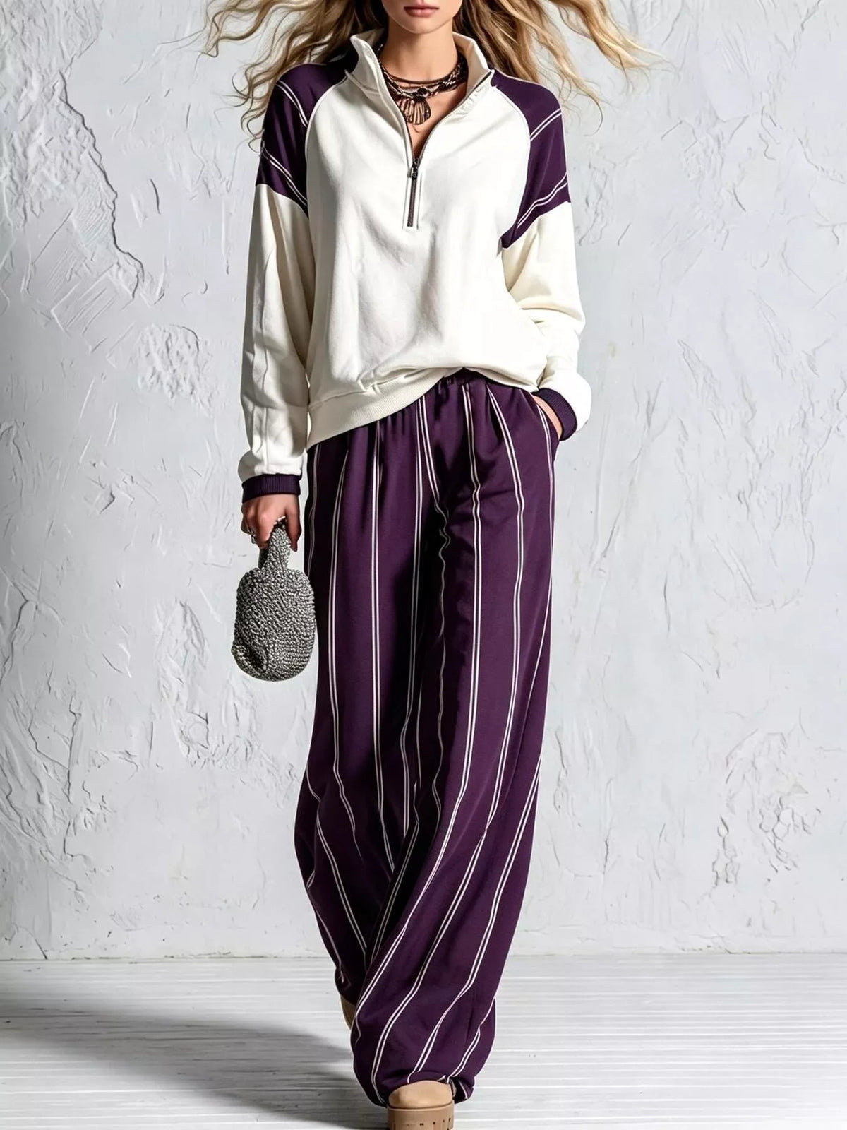 Purple striped lounge set with quarter-zip pullover and wide-leg pants