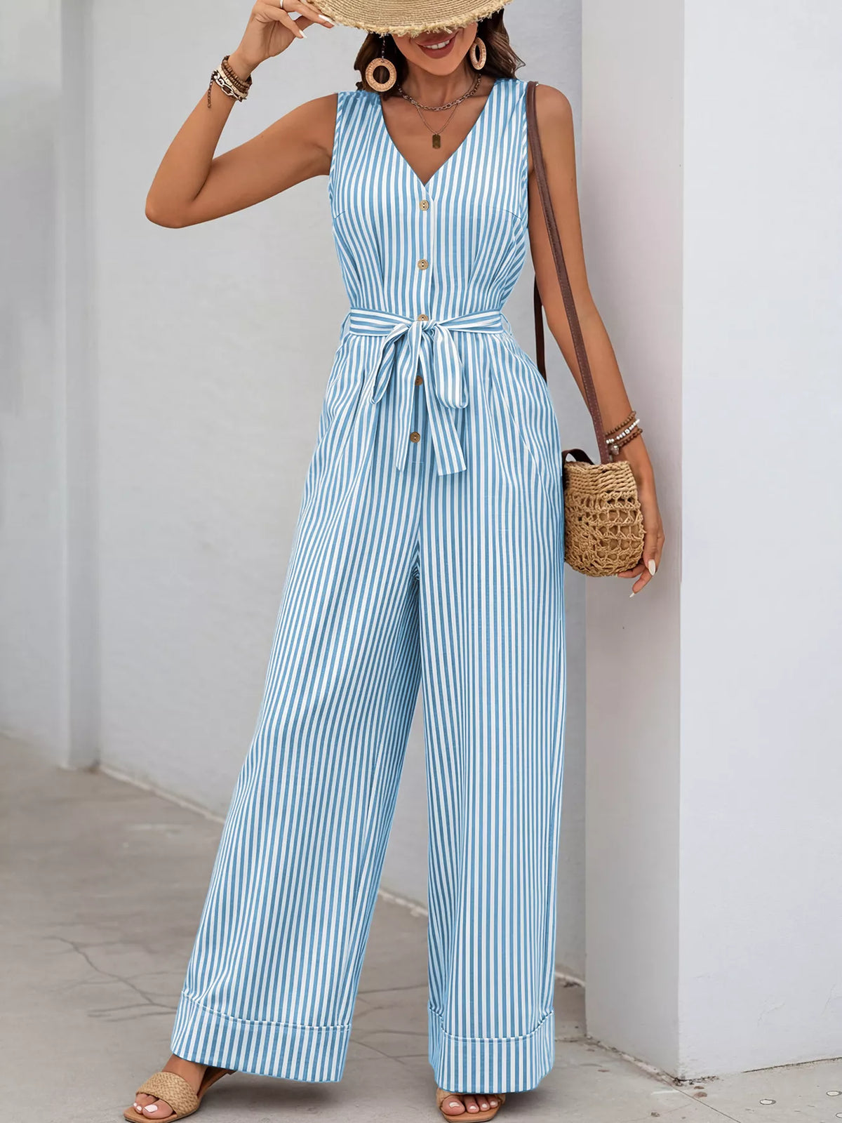 Striped sleeveless V-neck belted jumpsuit in light blue and white, tie waist, wide-leg