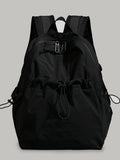Black lightweight drawstring backpack bag with front pocket and top drawcord tie