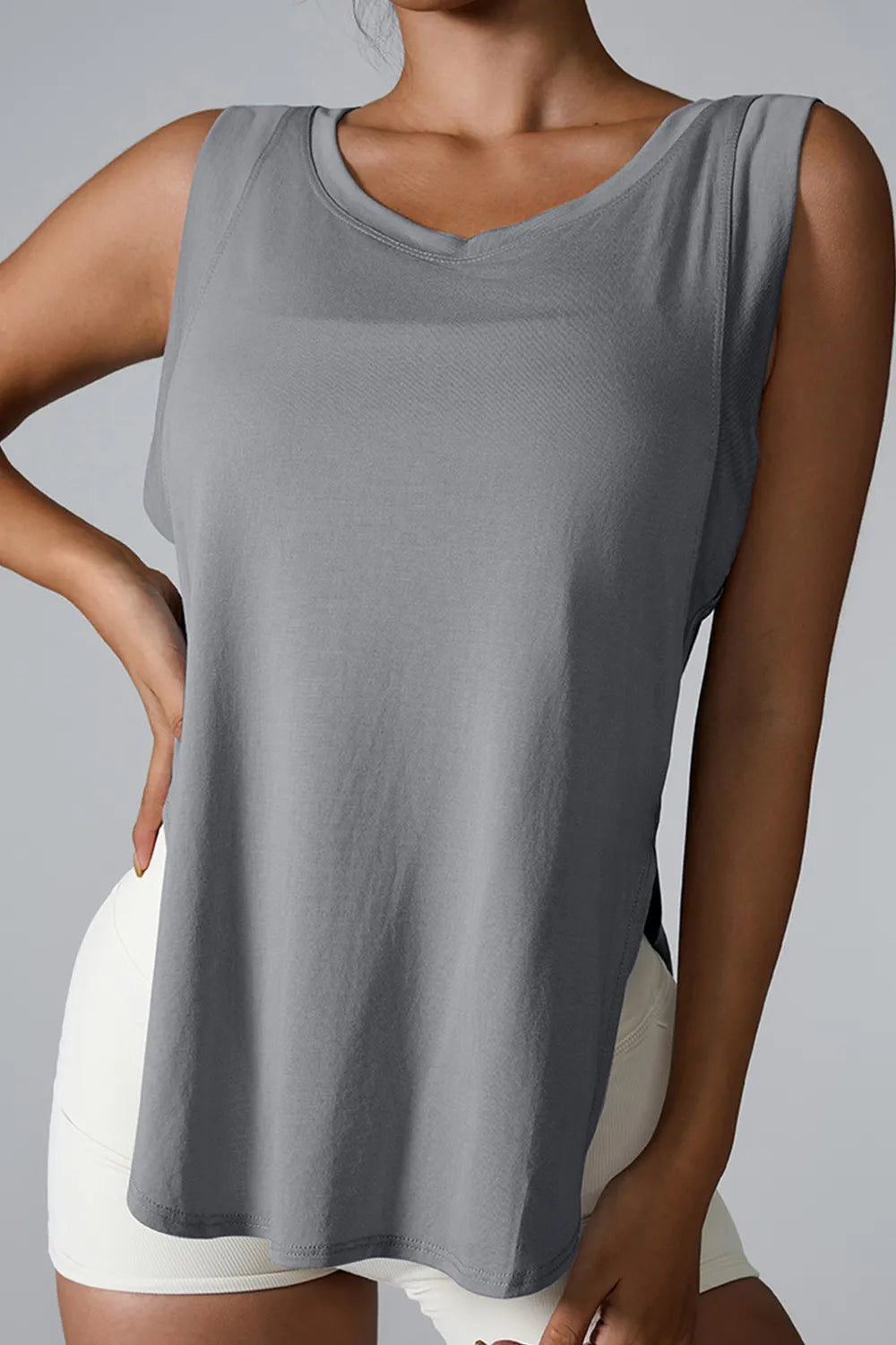 Gray sleeveless active tank top with round neck and side slit hem