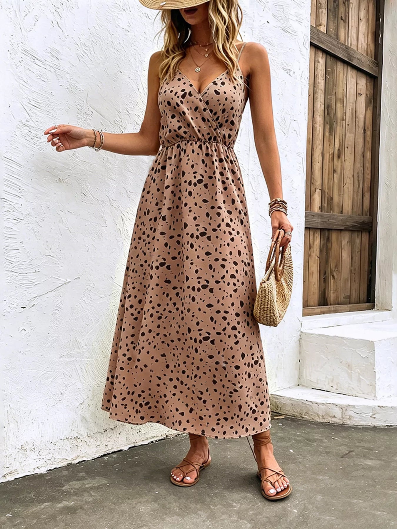 Taupe dot-print midi dress with spaghetti straps and gathered waist, front view.