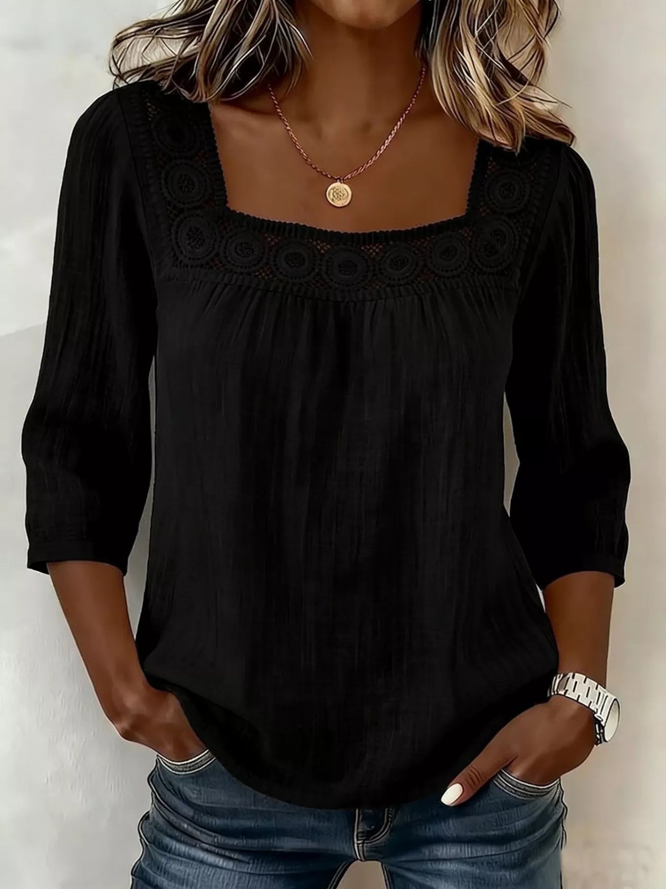 Black square-neck blouse with crochet trim, gathered neckline, and three-quarter sleeves