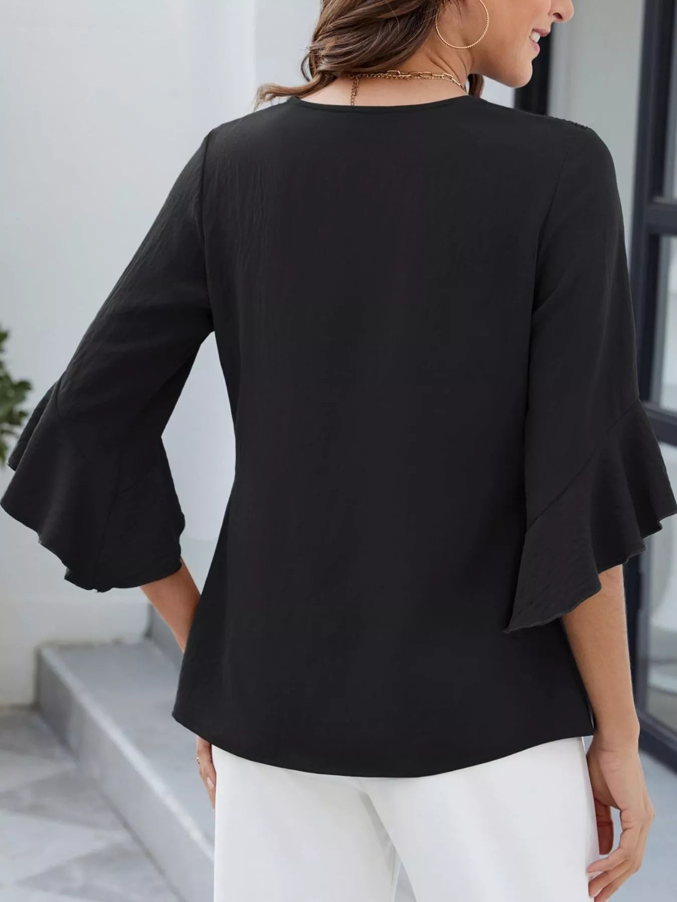 V-Neck Ruffle Sleeve Blouse in black with flared bell sleeves
