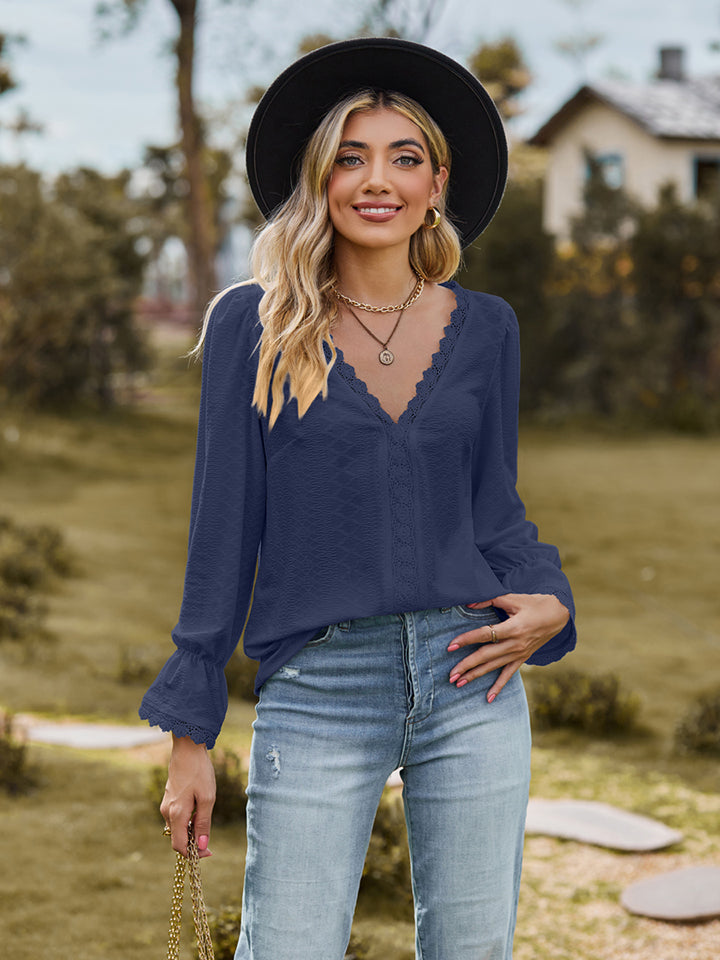 Flounce-sleeve blouse in navy, V-neck with lace trim and gathered flounce cuffs
