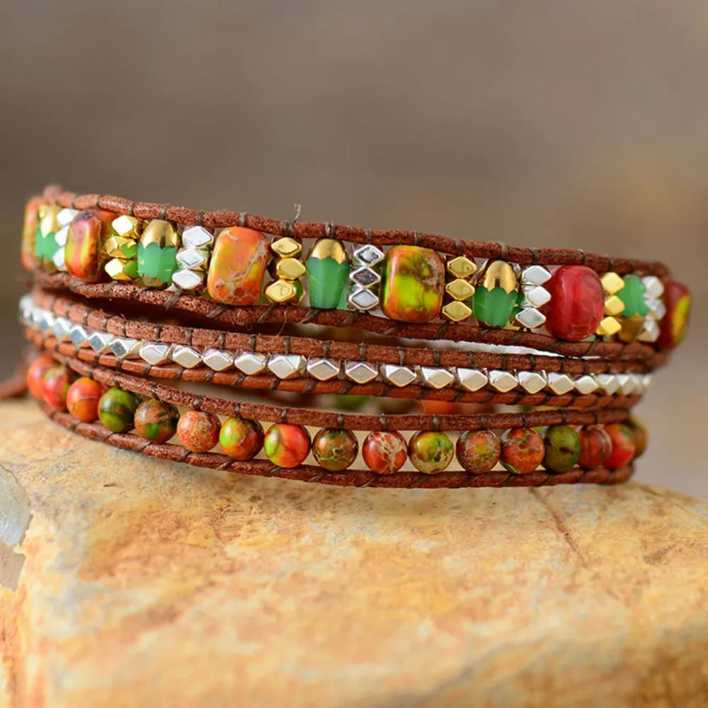 Natural stone woven bracelet with orange, green and gold bead details
