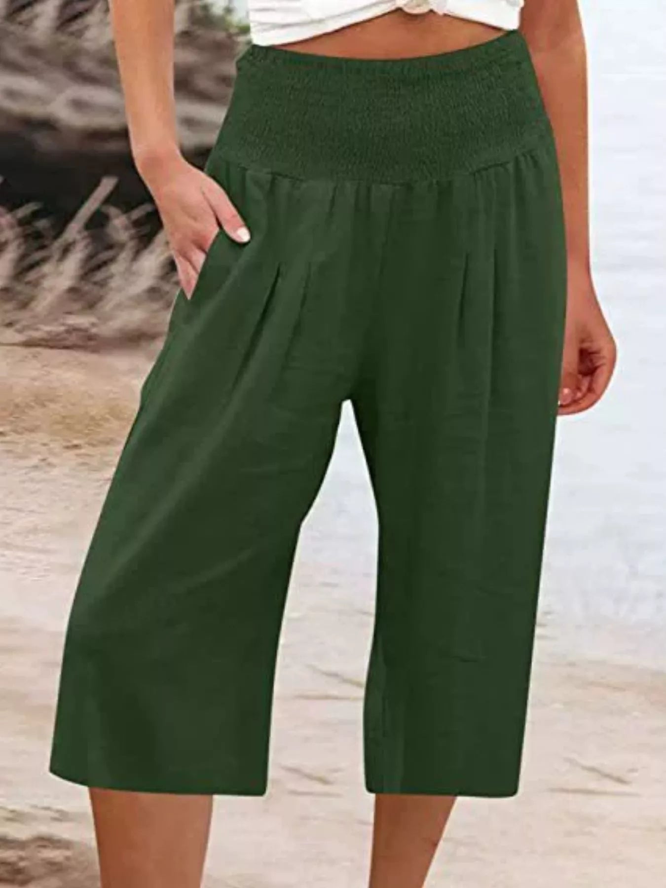 Smocked wide-leg capri pants in dark green, gathered elastic waist and wide cropped legs