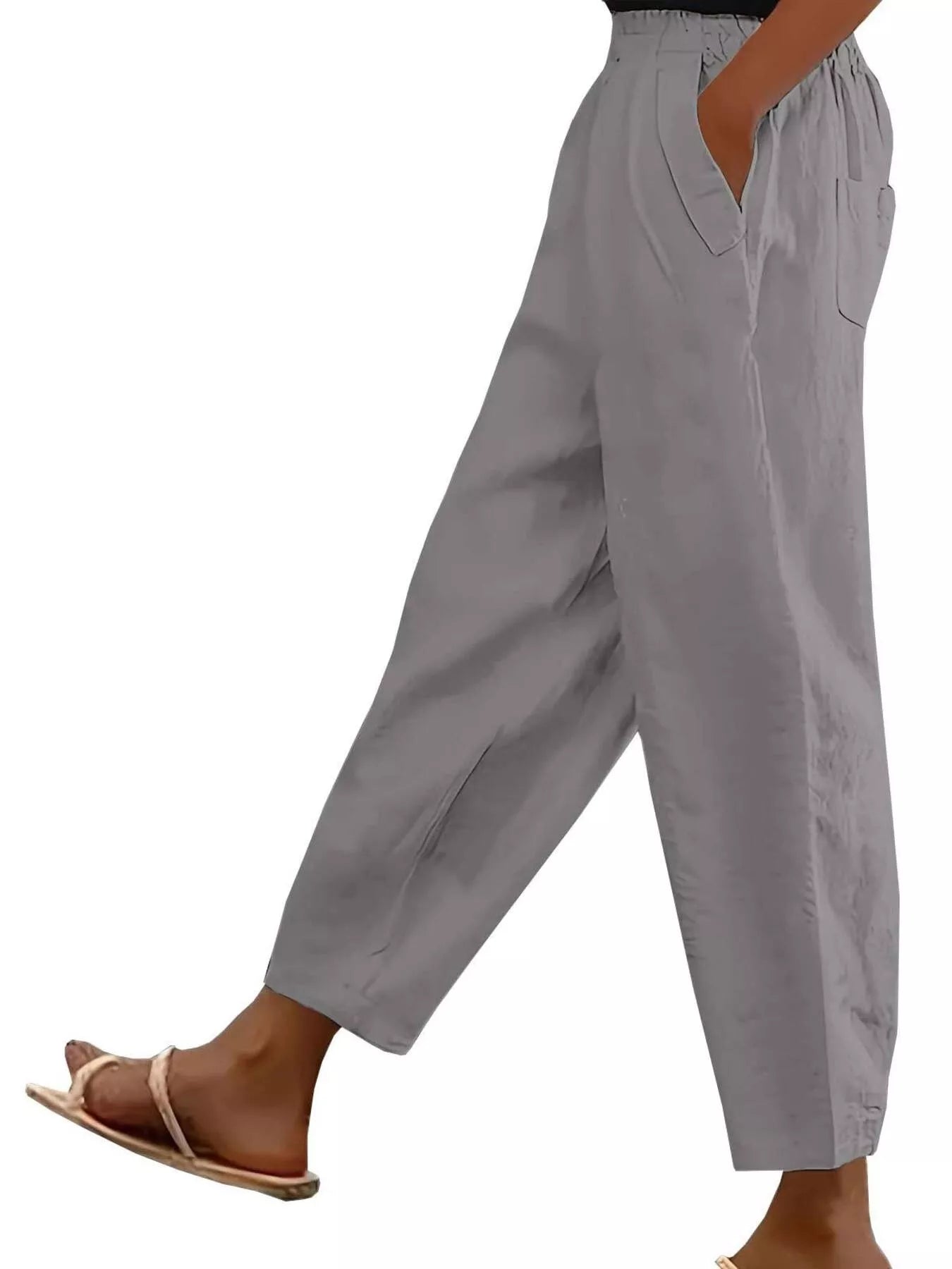 Gray loose-fit polyester pants with front pockets and tapered cuffs