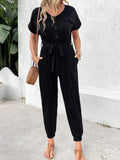 Black V-neck short-sleeve jumpsuit with button front and waist tie