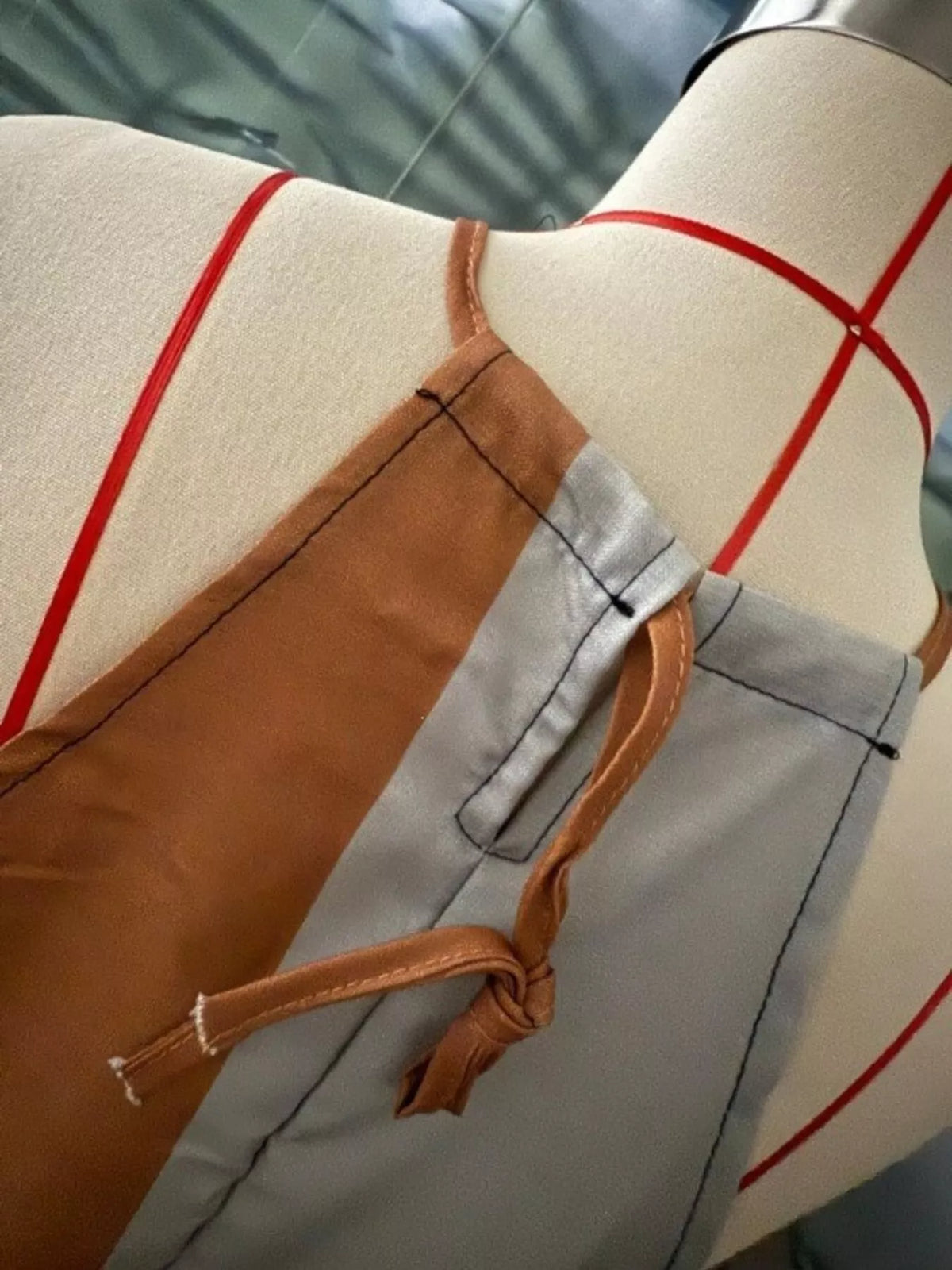 Dress side seam detail: tan leopard print panel with smooth gray fabric