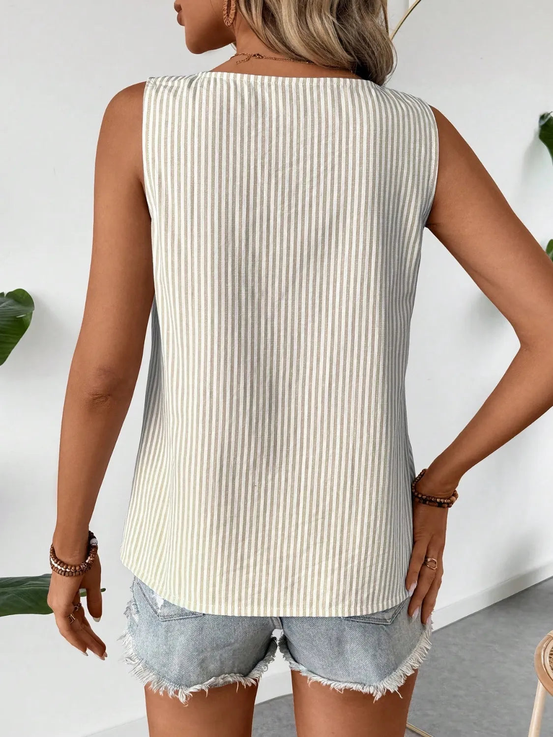 Back view of beige striped sleeveless tank top